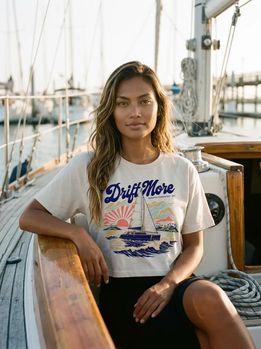 Running Downwind Crop Tee in Ecru worn aboard a sailboat