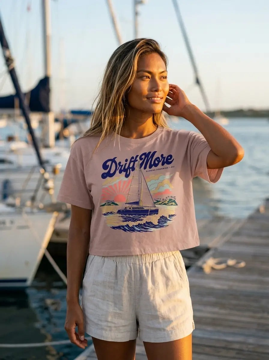 Running Downwind Crop Tee in Hazy Pink worn dockside at sunset