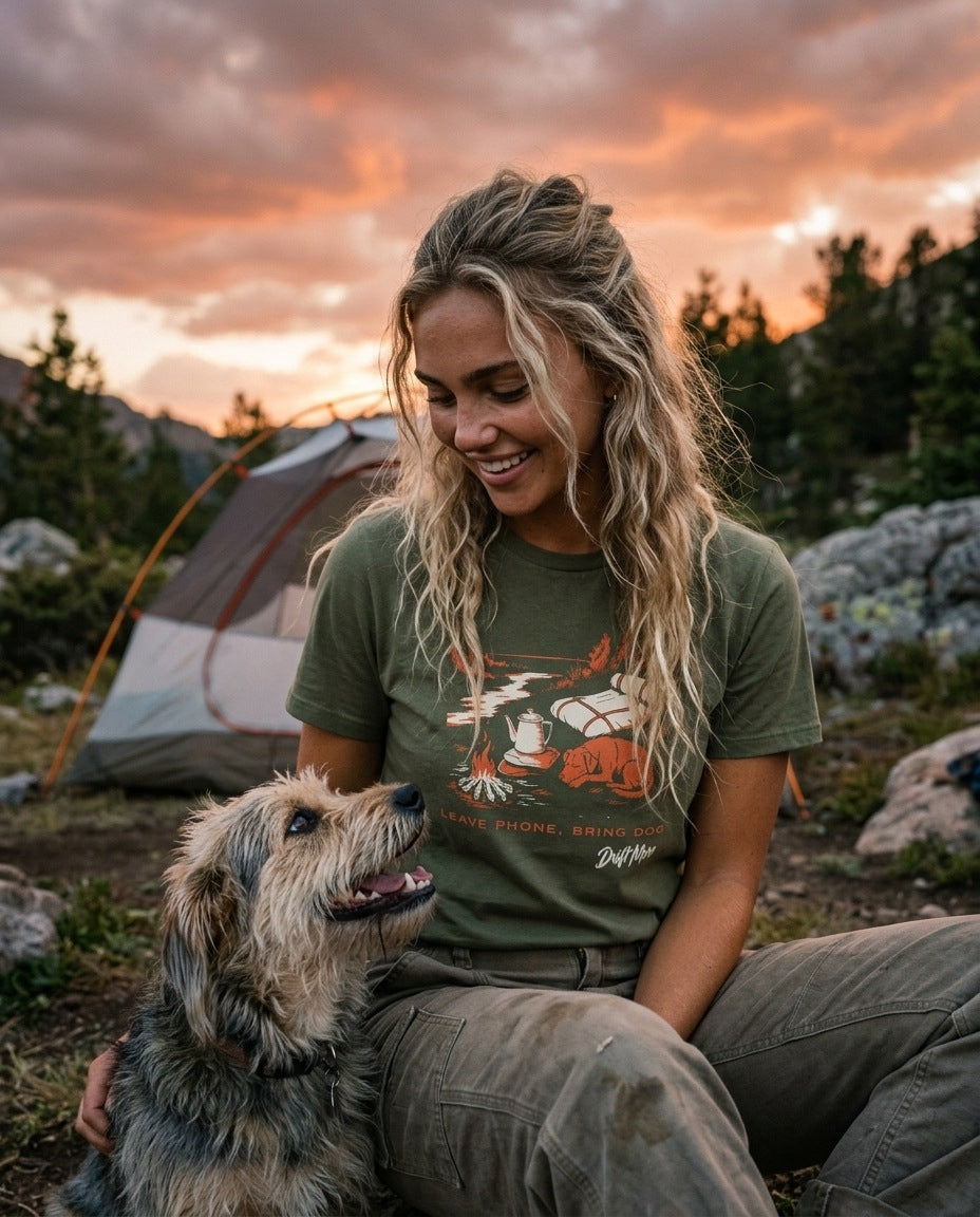 Leave Phone, Bring Dog Women's Tee in Military Green worn at a mountain campsite at dusk