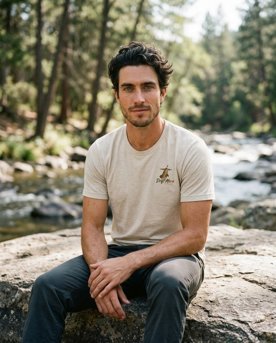 Match the Hatch Tee in Heather Natural worn streamside on a freestone river